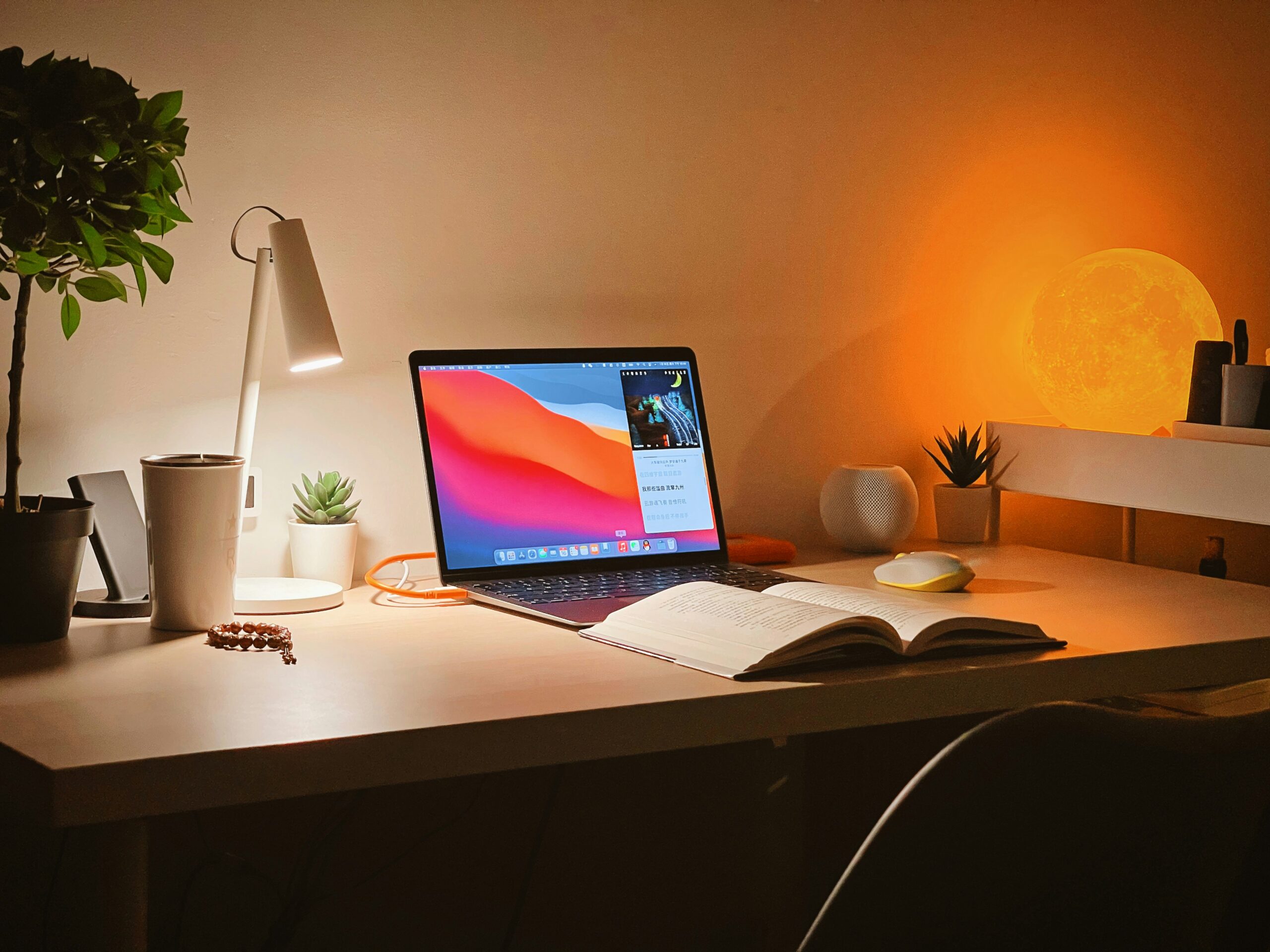 Person studying at desk with laptop and open book for MQF Level 5 qualification in Malta